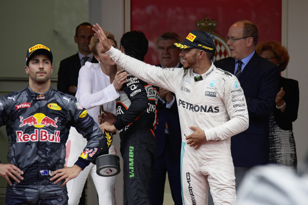 Daniel Ricciardo and Lewis Hamilton on the podium at the 2016 Monaco F1 Grand Prix.