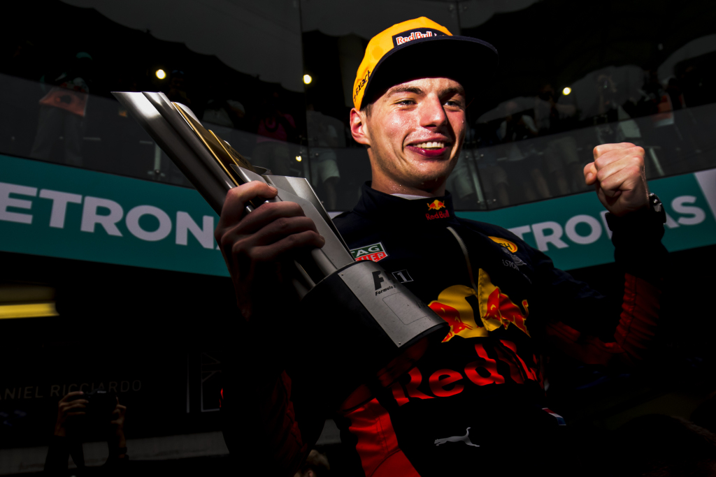 Max Verstappen with the winner's trophy in Malaysia.