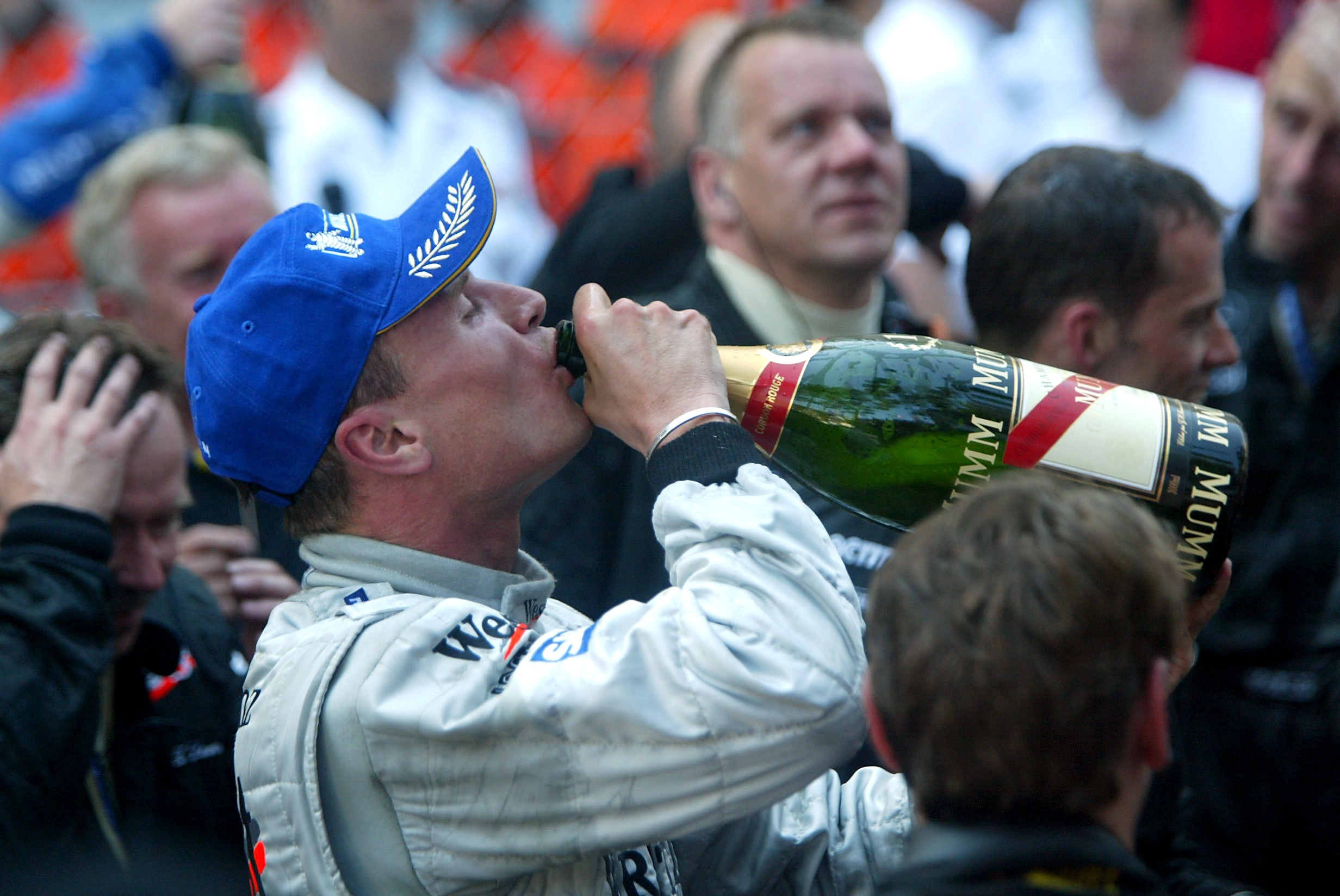 David Coulthard drinking champagne after the Monaco Grand Prix