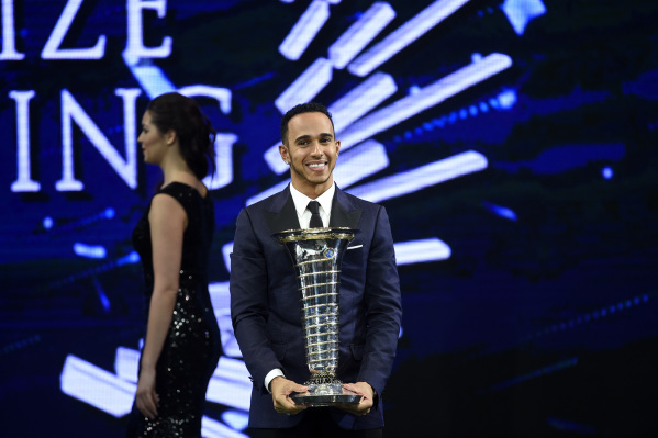 Lewis Hamilton holding a trophy