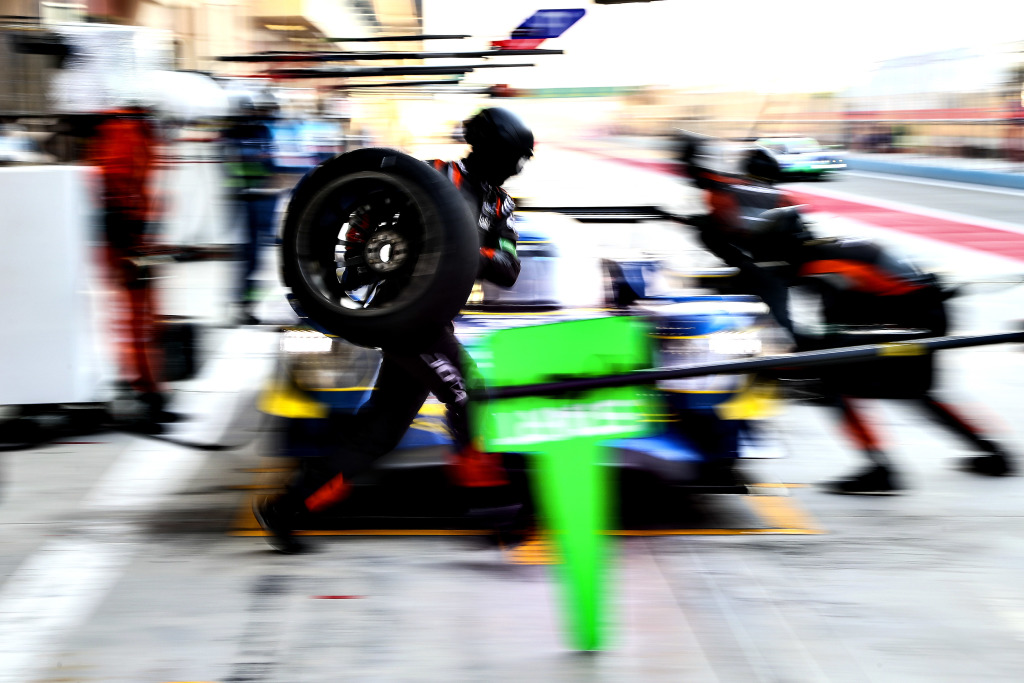 A pit crew perform a pitstop during a WEC race