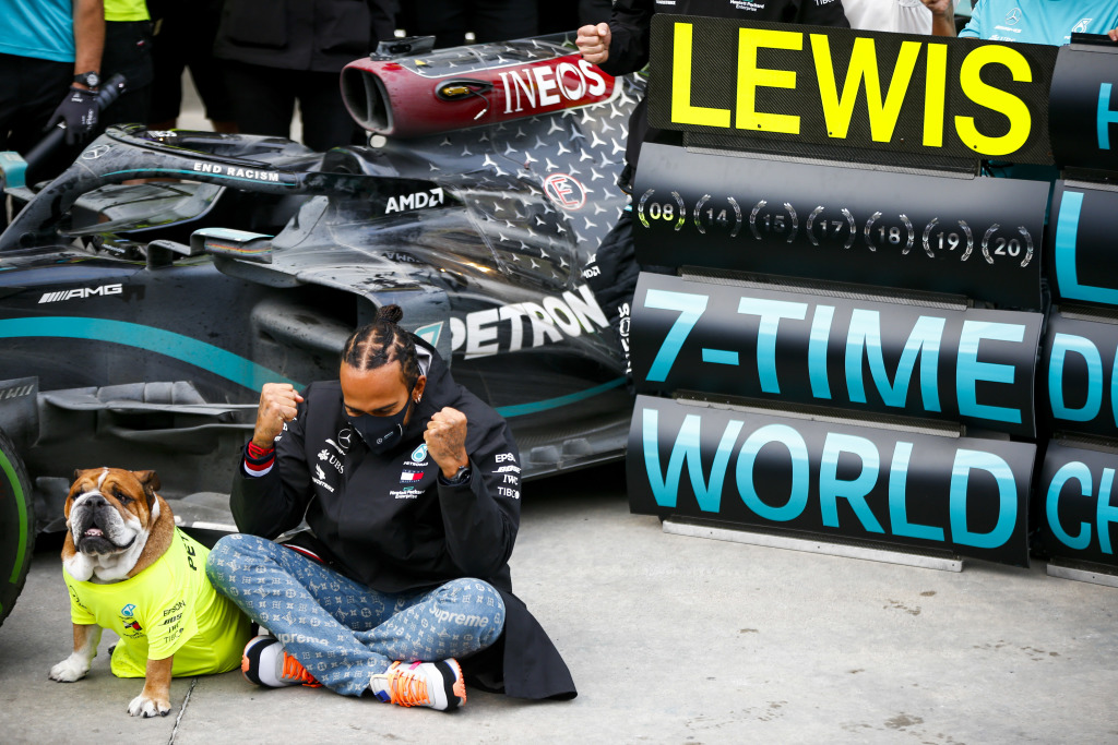 Lewis Hamilton celebrating his world championship with his dog, Roscoe