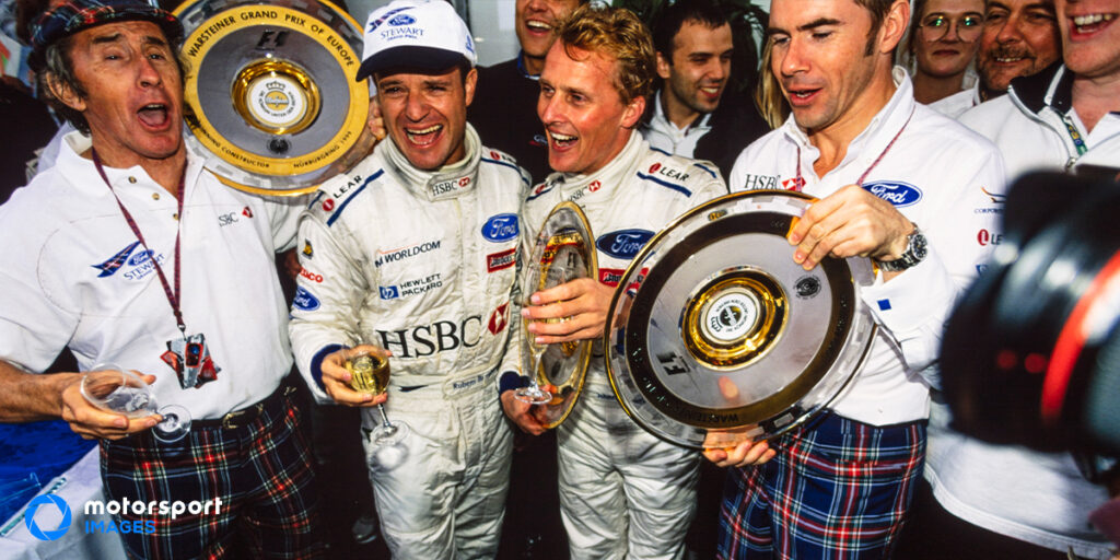 F1 team Stewart Grand Prix celebrate their first win
