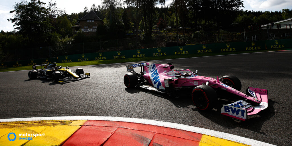 Two Formula 1 cars racing at the Belgian Grand Prix