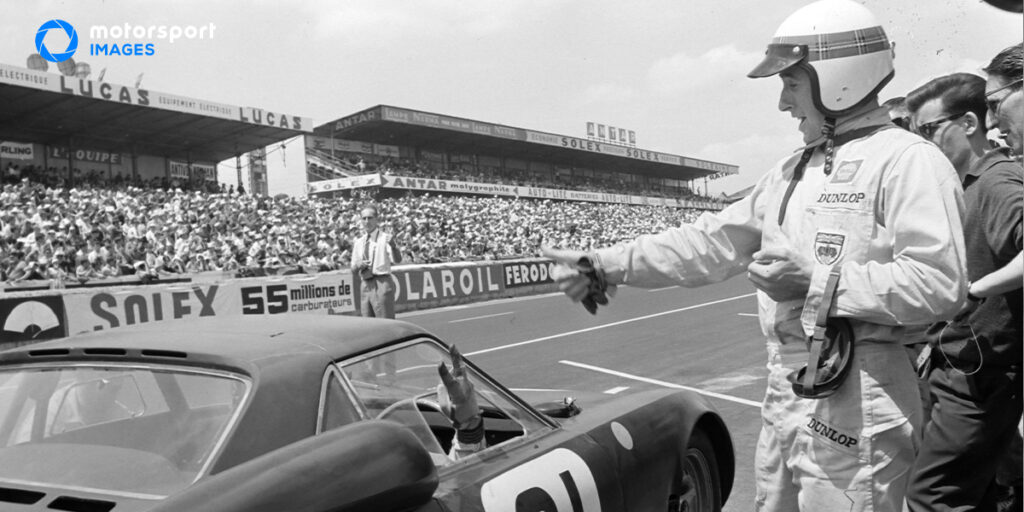 Graham Hill drives a car at the Le Mans 24 Hours