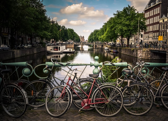 Bikes on a bridge over a canal in Amsterdam
