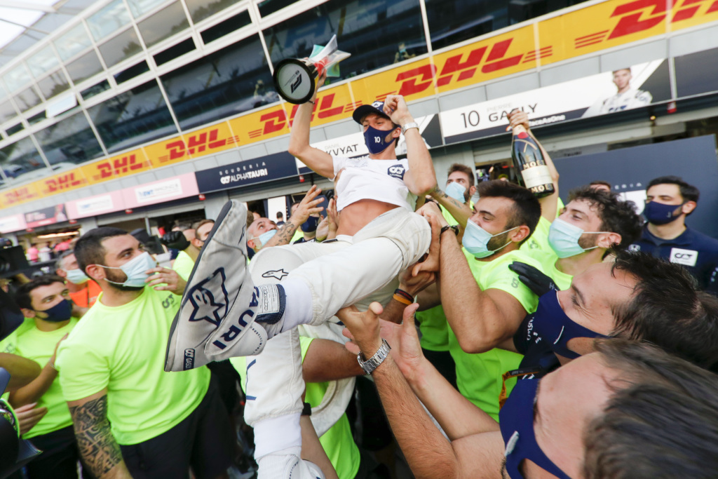 Pierre Gasly is lifted by his team in celebration of winning the Italian Grand Prix