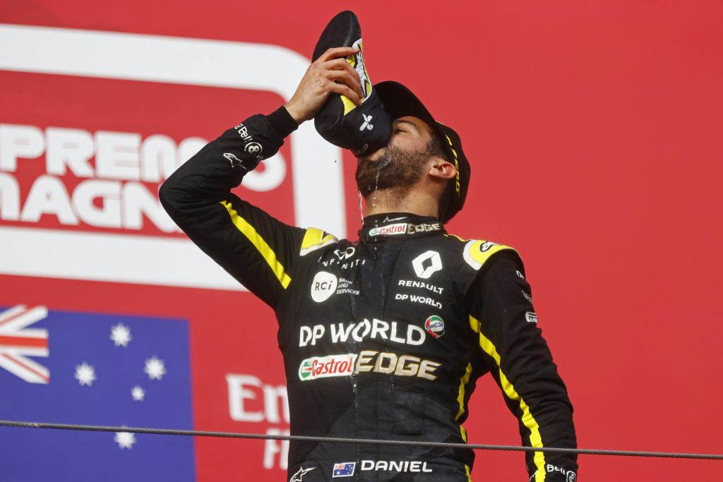 F1 driver Daniel Ricciardo drinks champagne from his boot