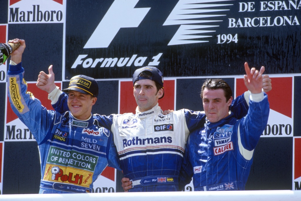 Michael Schumacher, Damon Hill and Mark Blundell celebrate on the podium