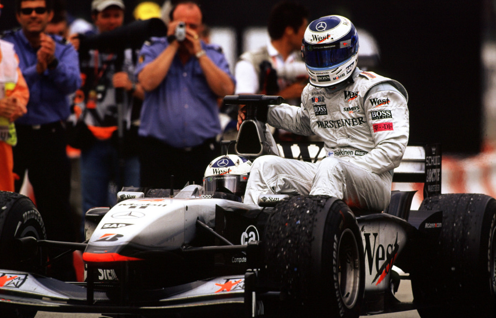Mika Hakkinen on the side of a Formula 1 car