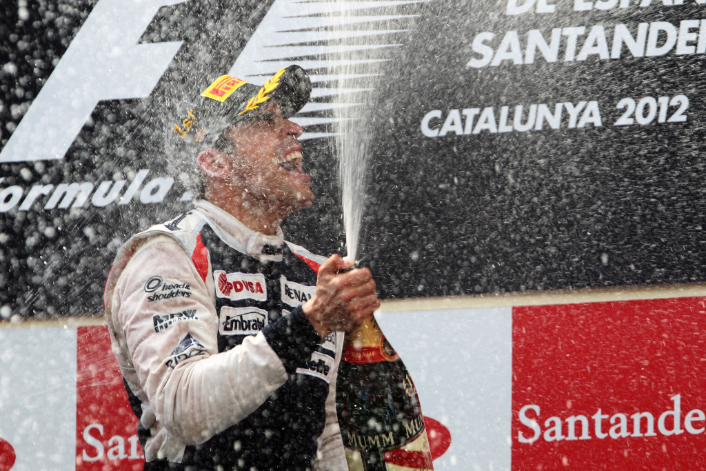 Pastor Maldonado spraying champagne after winning the Spanish Grand Prix
