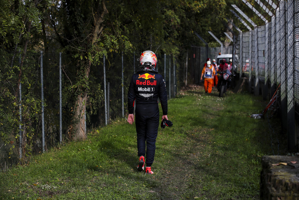 Max Verstappen walking away from a crash