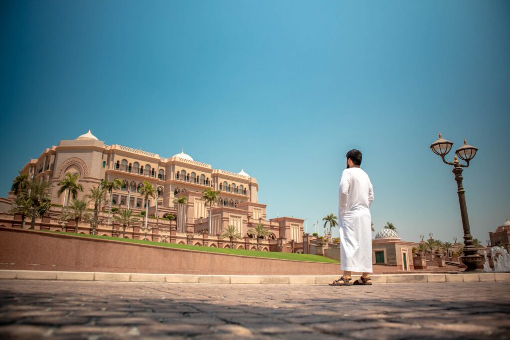 A man looks up at Emirates Palace