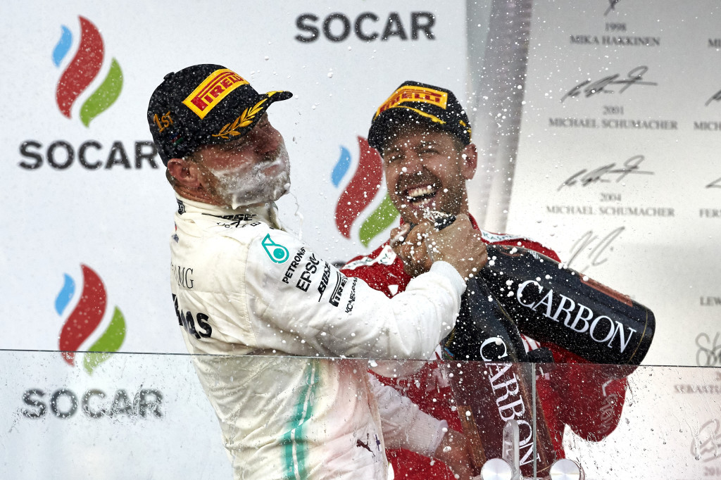 Sebastian Vettel and Valtteri Bottass celebrating with champagne at the Azerbaijan Grand Prix 2019