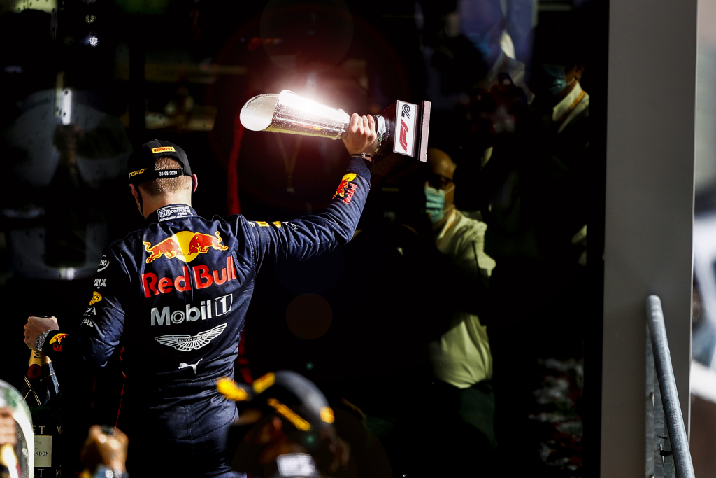 Max Verstappen holds the third-place trophy at the Belgian Grand Prix