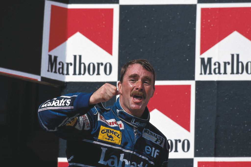 Nigel Mansell celebrates by punching the air