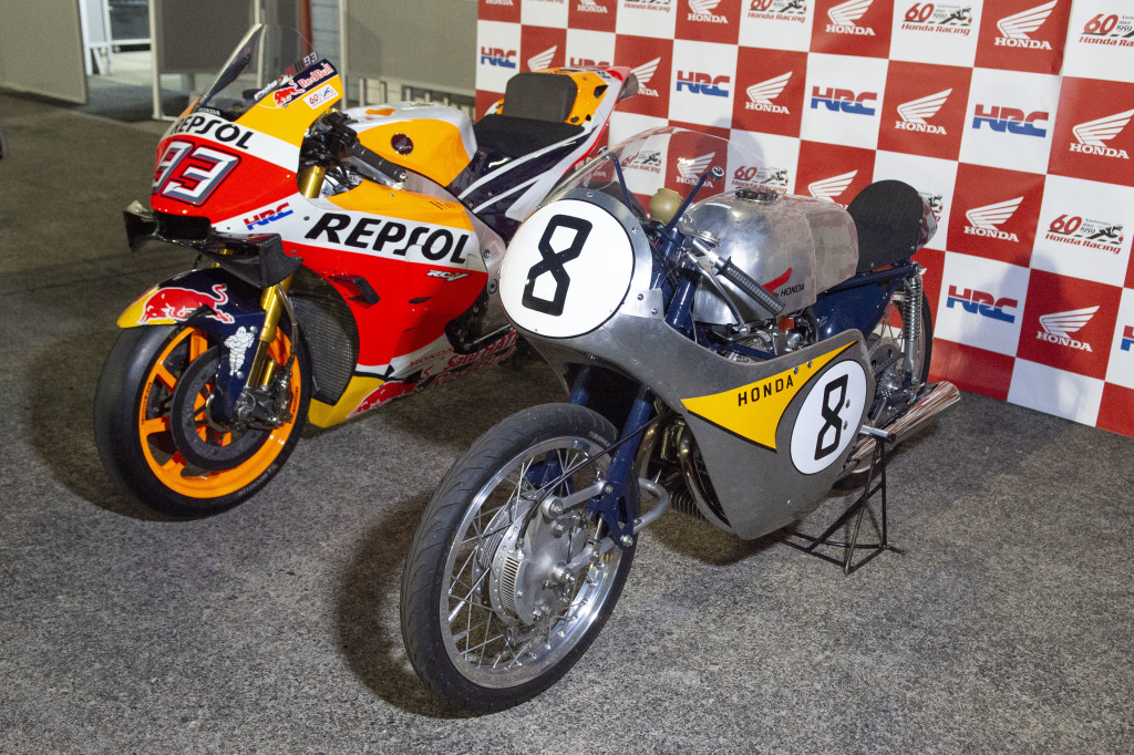 A modern and a vintage Honda MotoGP bike