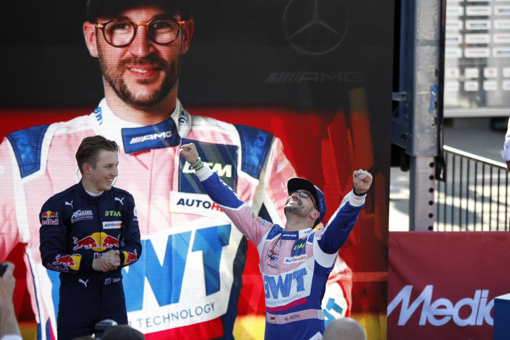 Maximilian Götz celebrates a DTM race win with his arms aloft