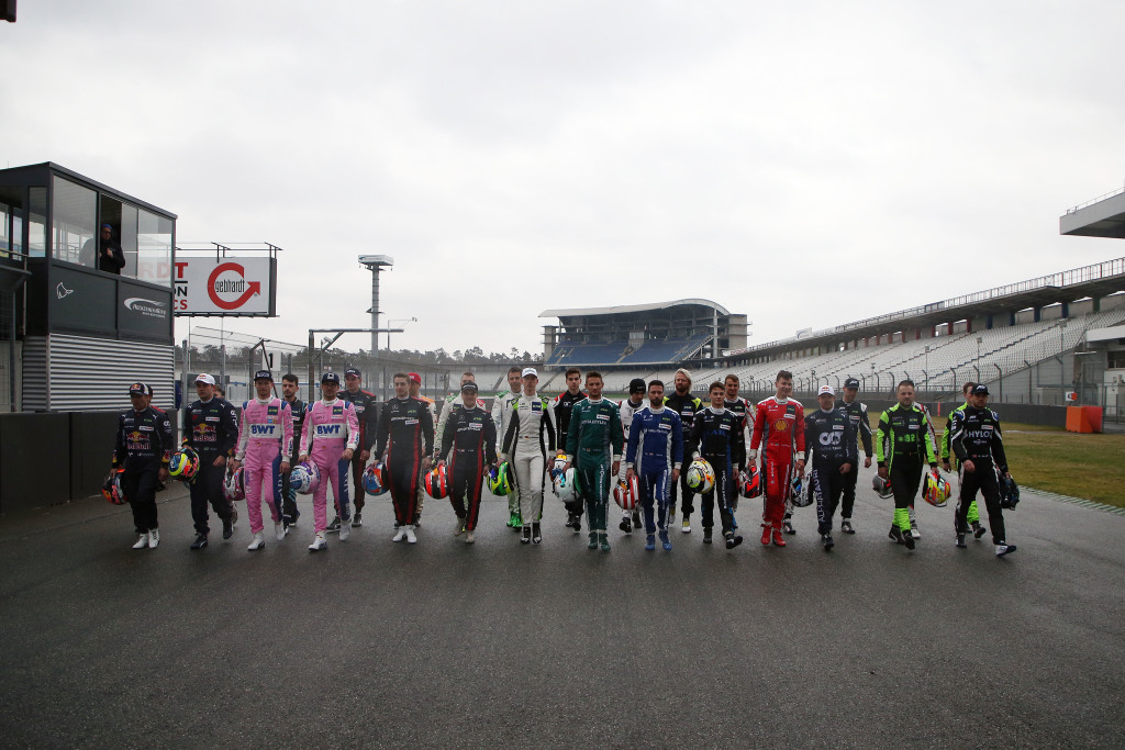 Drivers walking on a racing track