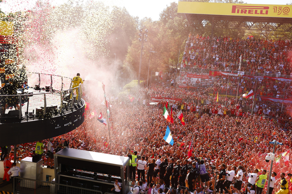 Charles Leclerc celebrates above Formula 1 fans